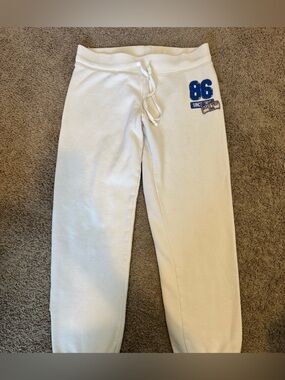 PINK Victoria's Secret Cream Sweatpants with Blue '86' Patch